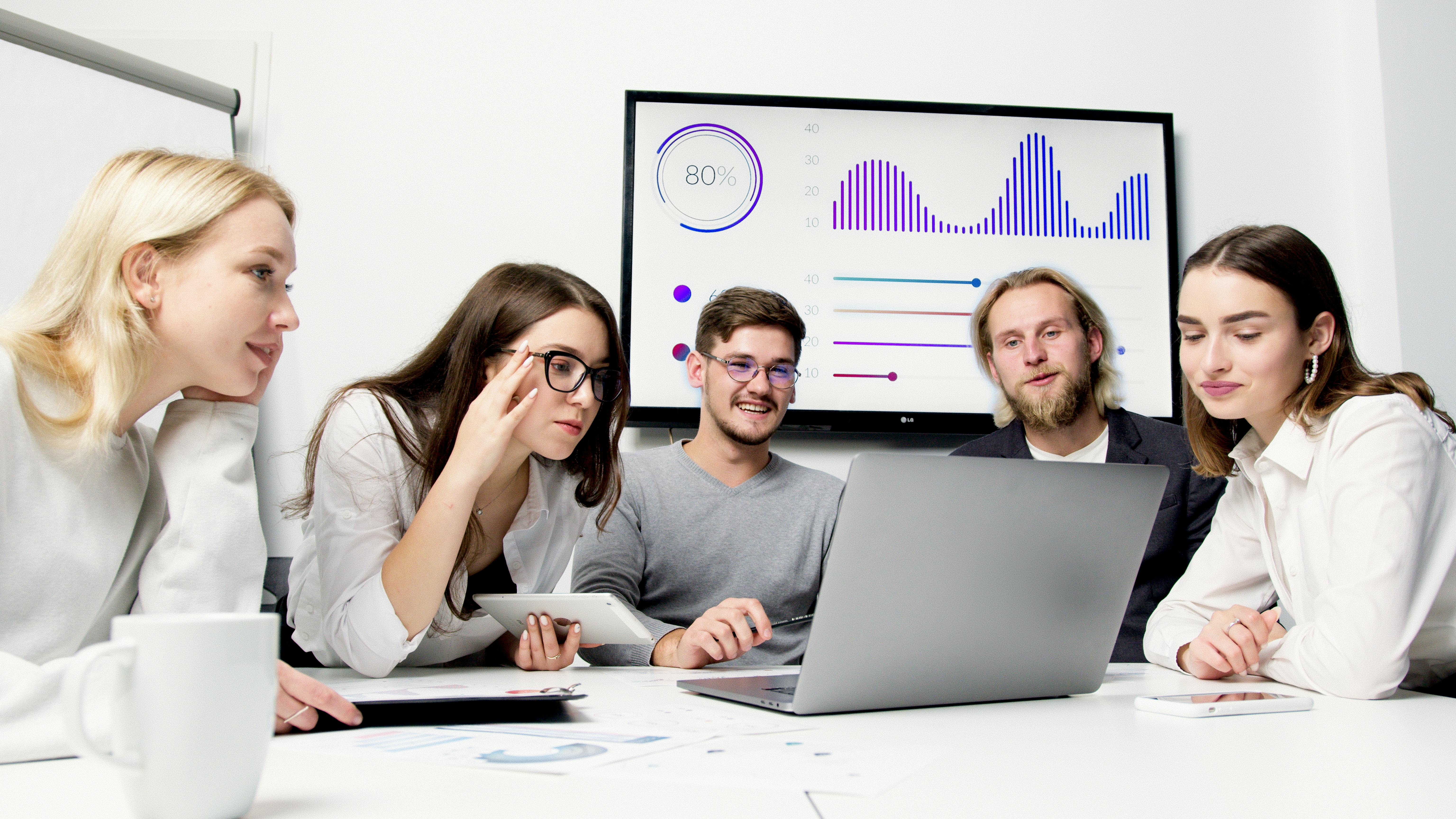 Professional CRO team collaboration workspace showing data analysts, UX researchers, and developers working together on conversion optimization projects - conversion rate optimisation company