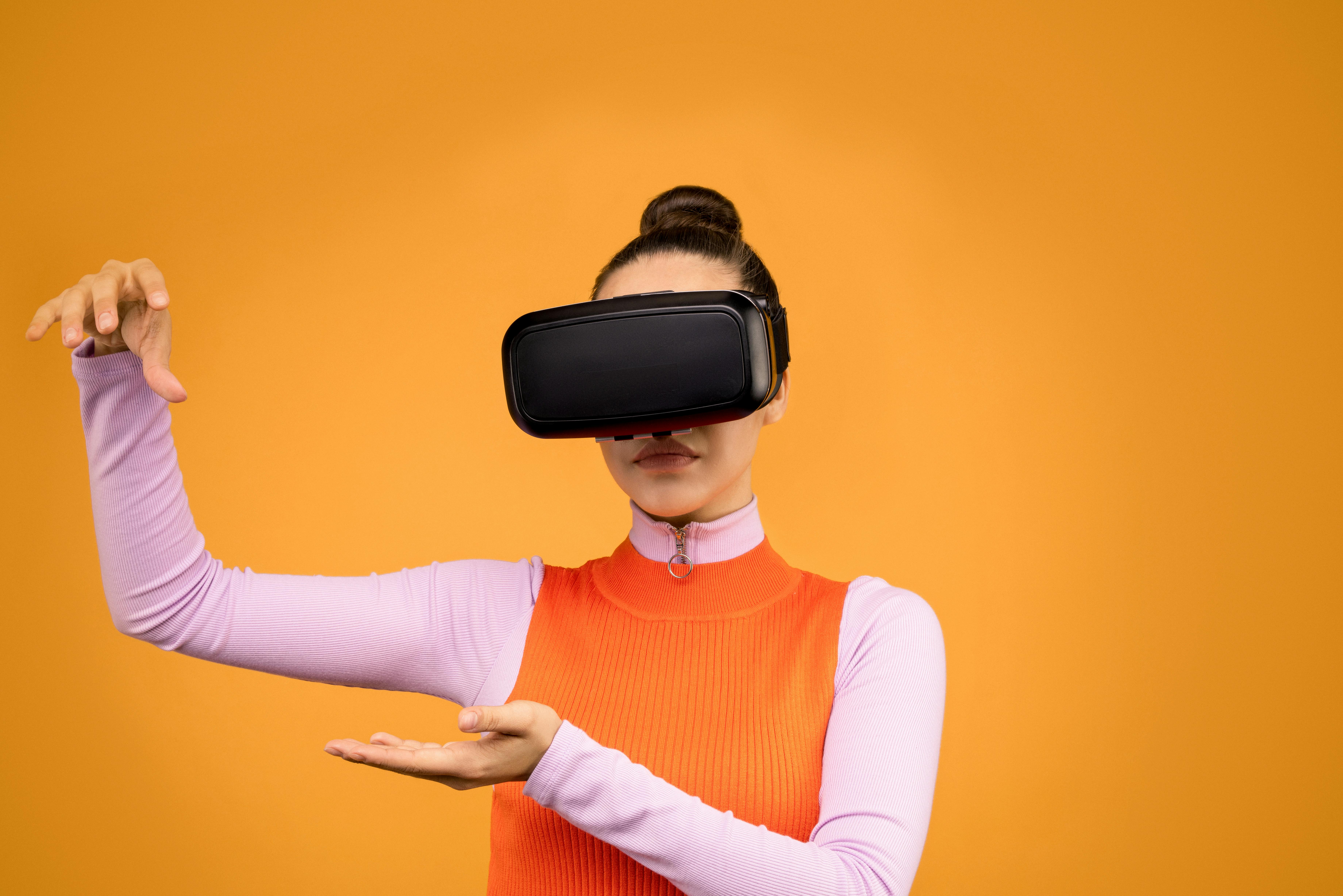 Person wearing a VR headset to view a 360-degree video - video production for corporate